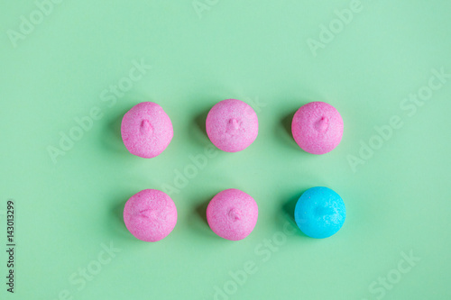 photo of tasty pink and blue marshmallows on the wonderful green studio background