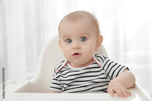 Adorable baby girl sitting ...