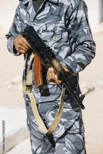 An unrecognizable armed person