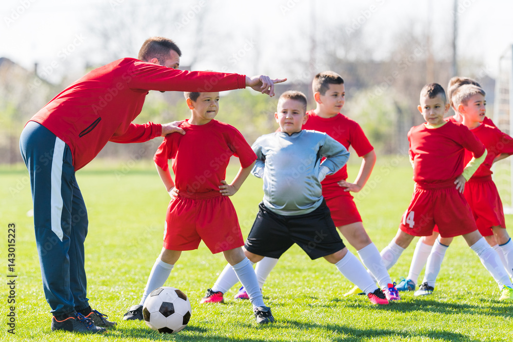Φωτογραφία Kids soccer football - children players exercising before match on soccer field