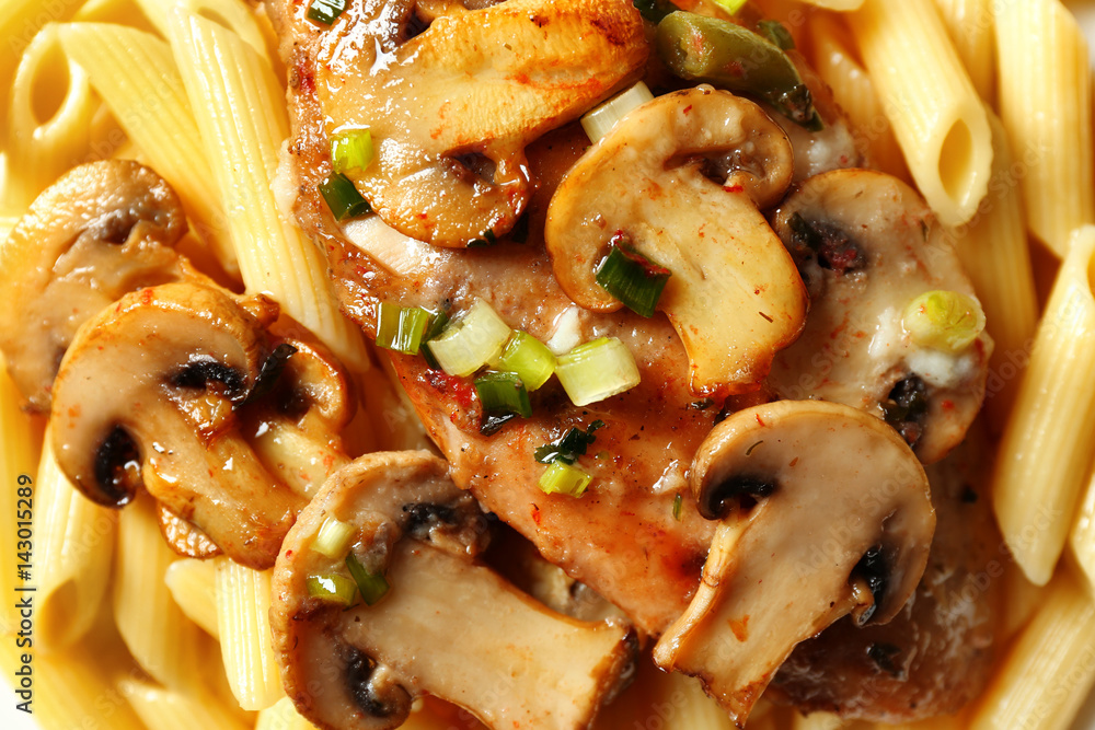 Tasty chicken marsala with pasta, close up Tasty chicken marsala with pasta, close up