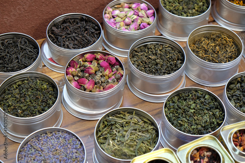 Canvas Print Various types of tea in metal pots exposed for sale in a Chinese tea shop in Sha