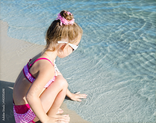 Little girl having fun on beach vacation