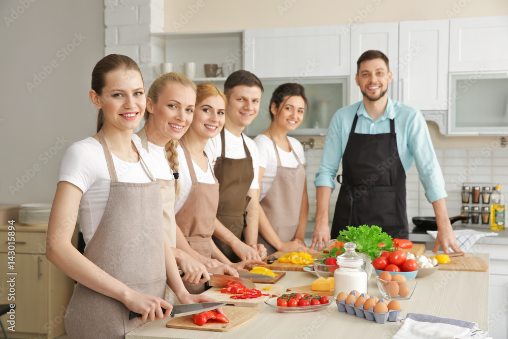 Male chef and group of people at cooking classes Male chef and group of people at cooking classes