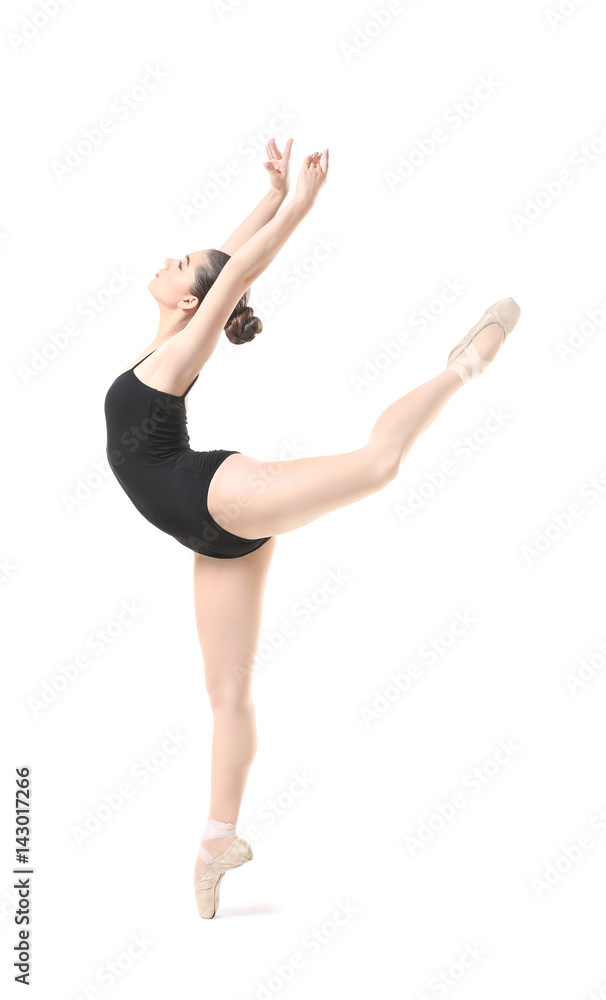 Young beautiful ballerina dancing on white background