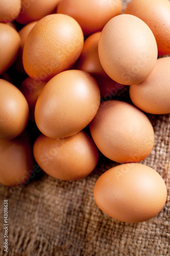  Eggs on wooden background close up may use as wallpaper, poster, ad