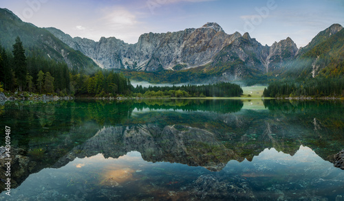 Dawn over the alpine lake Laghi di fusine in the julian alps in italy,High resolution photo © Mike Mareen