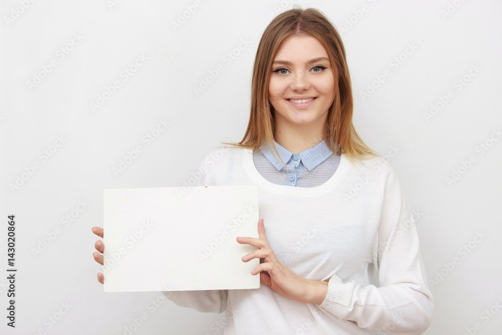 Young smiling woman show blank card or paper Young smiling woman show blank card or paper