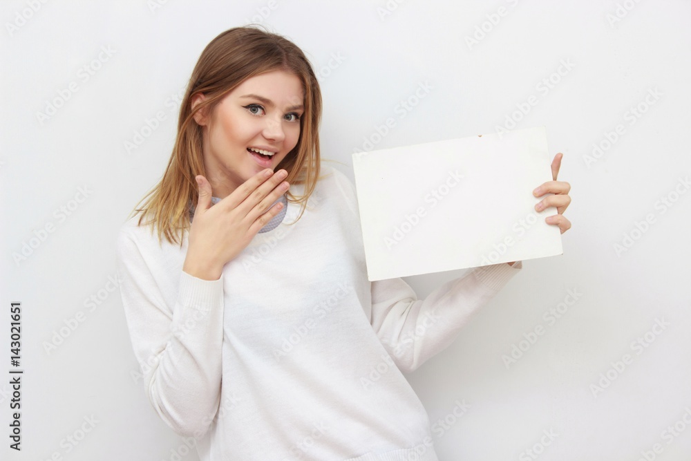 Young smiling woman show blank card or paper Young smiling woman show blank card or paper