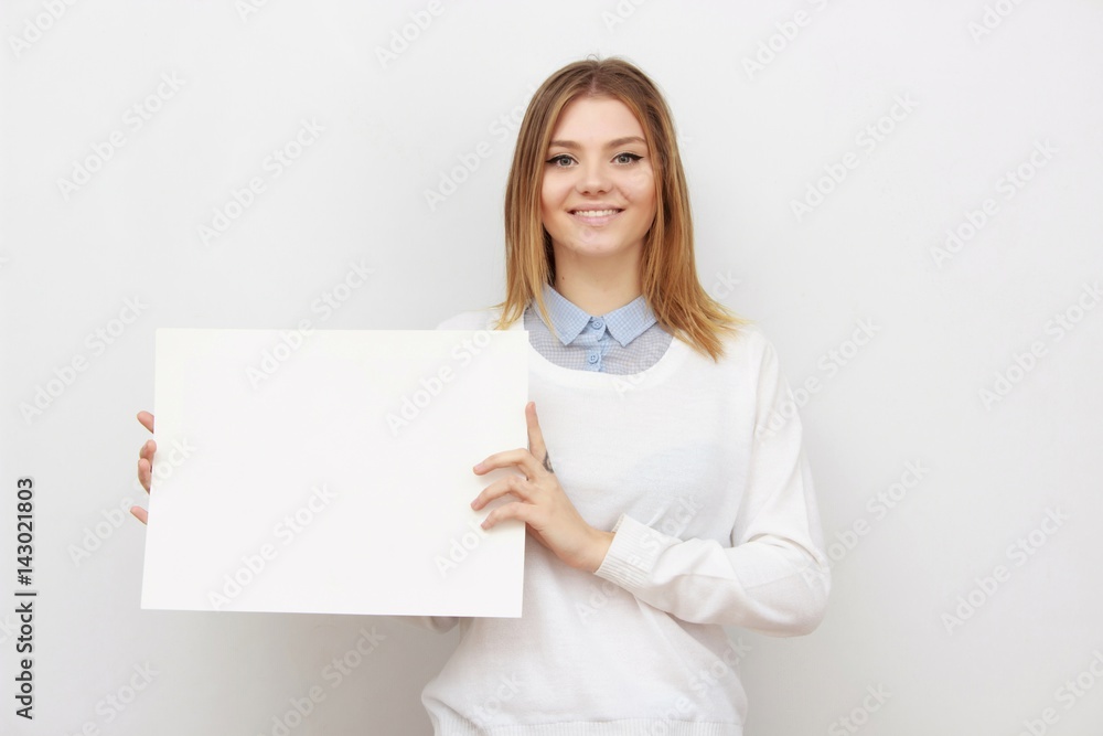 Young smiling woman show blank card or paper Young smiling woman show blank card or paper