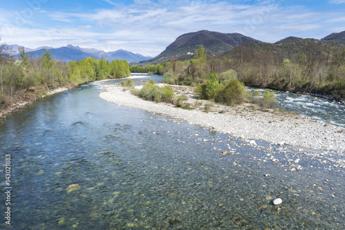 Sesia river (Valsesia, Piedmont, Italy) in springtime, this river is famous for kayaking and rafting; in this period increases the flow rate of water due to the melting of glaciers.