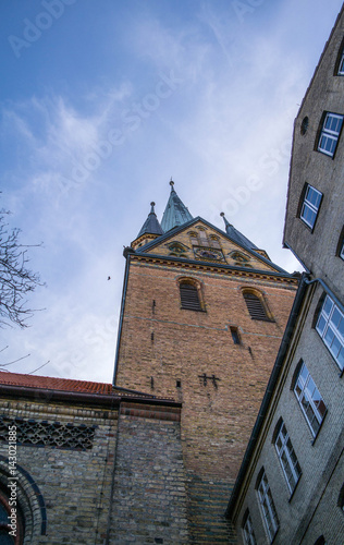 church tower of the Flensburg St Nikolai church from below against blue sky