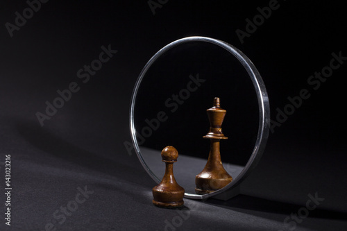 Pawn looking in the mirror and seeing a king.