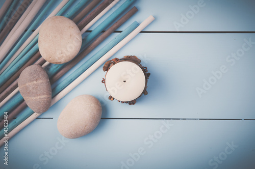 Stones and plant on the wooden background