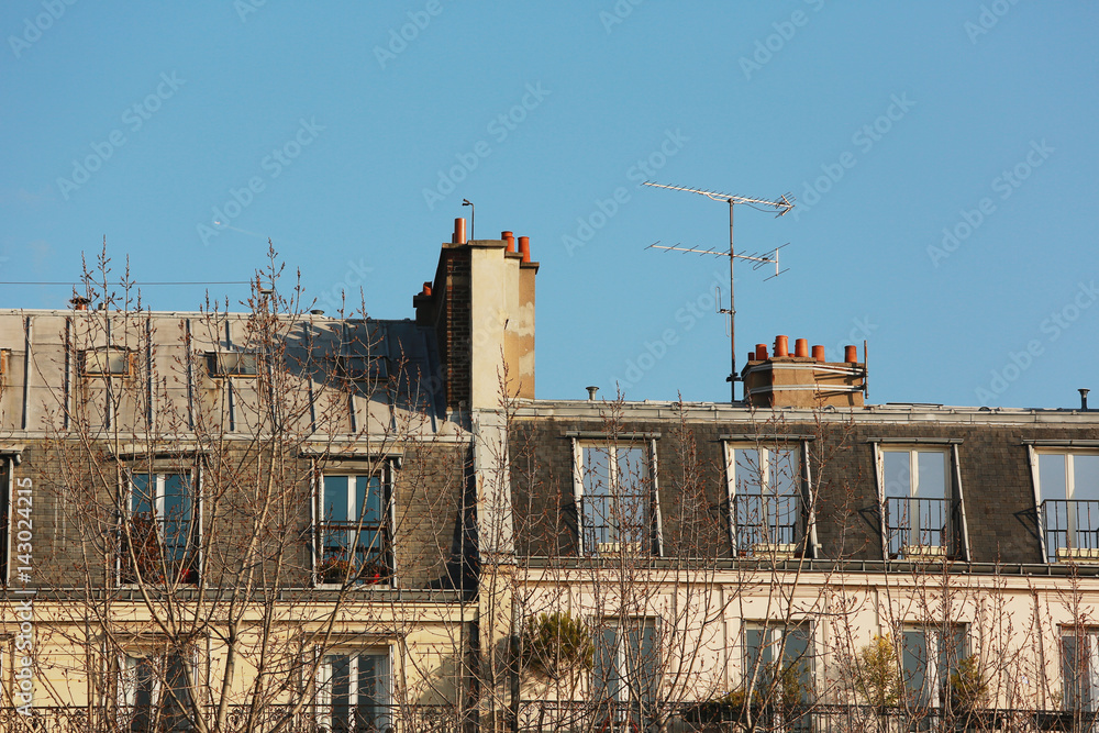 Chimneys on top of the roof of historical buildings in Paris Chimneys on top of the roof of historical buildings in Paris