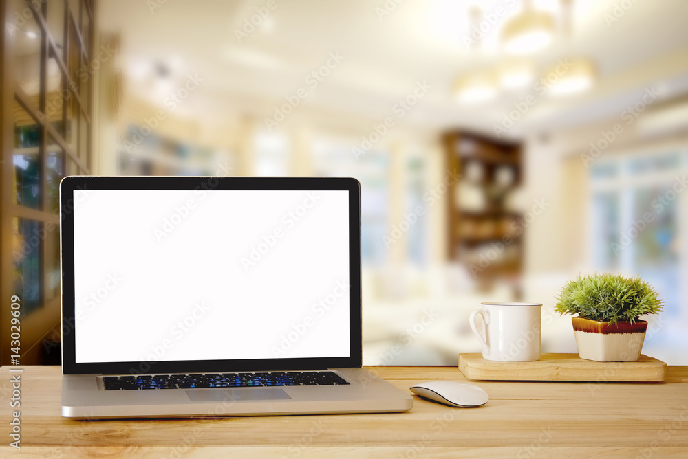Mock up Blank screen laptop on wood top table and blurred living room background. for Procuct display montage. Mock up Blank screen laptop on wood top table and blurred living room background. for Procuct display montage.