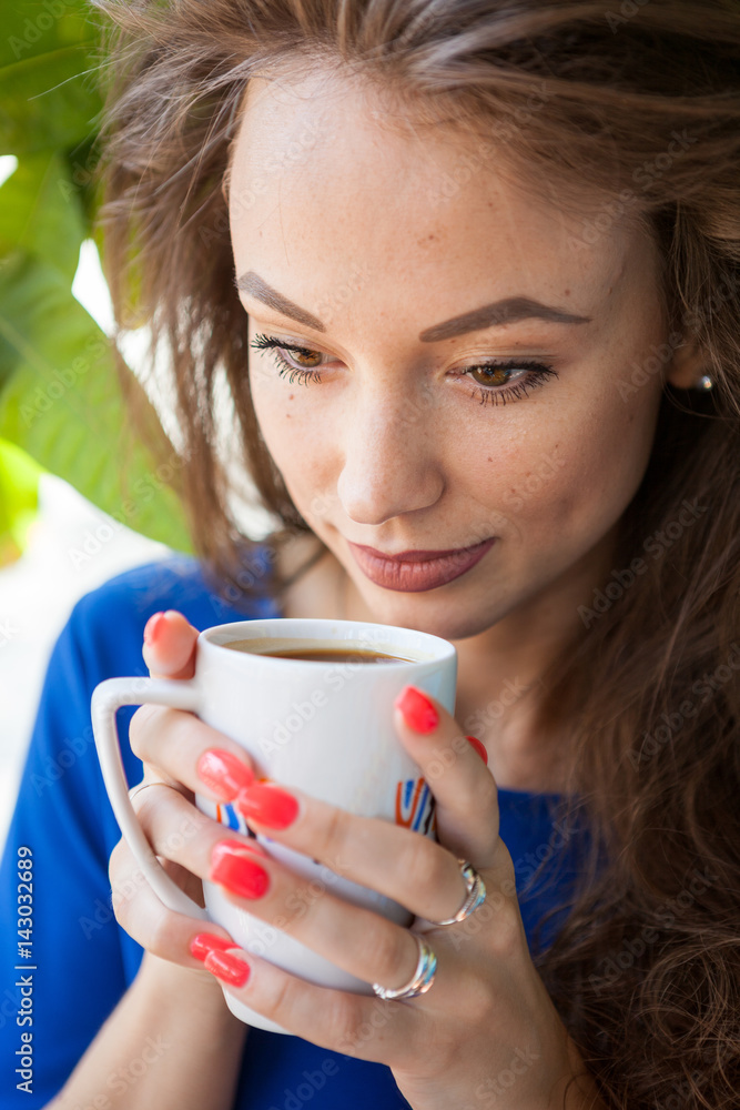 Beautiful woman drinking coffee at a terrace Beautiful woman drinking coffee at a terrace
