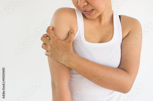 Woman scratch her arm from the itch or Woman suffering from arm pain Woman healthcare concept and ideas