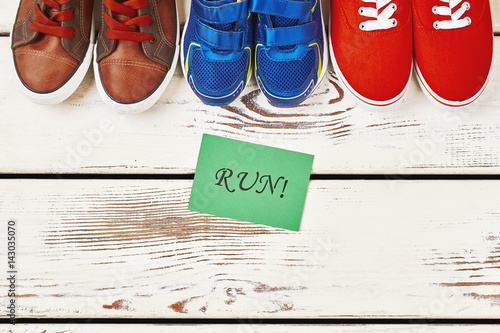 Φωτογραφία Sport shoes on wooden backdrop. Prevention is better than cure.