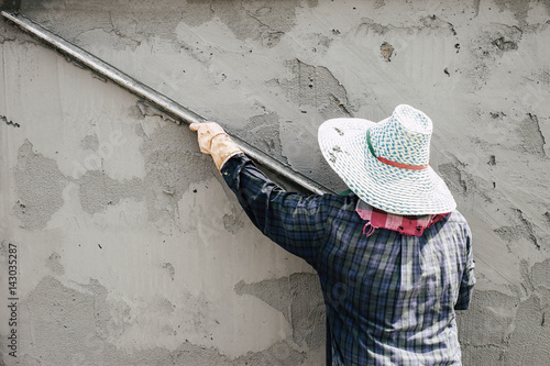 Workers were plastering. photo