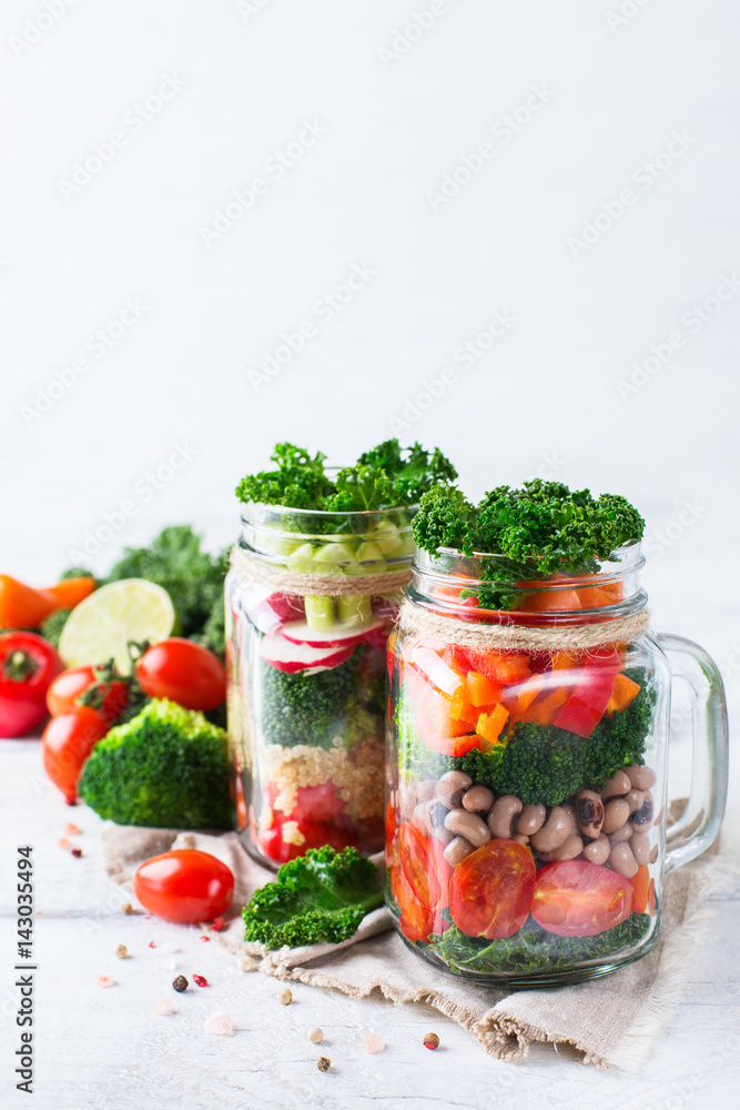 Healthy vegan salad in a mason jar with quinoa Healthy vegan salad in a mason jar with quinoa