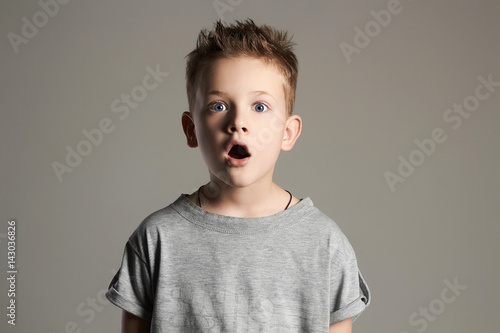 funny kid.surprised little boy. photo