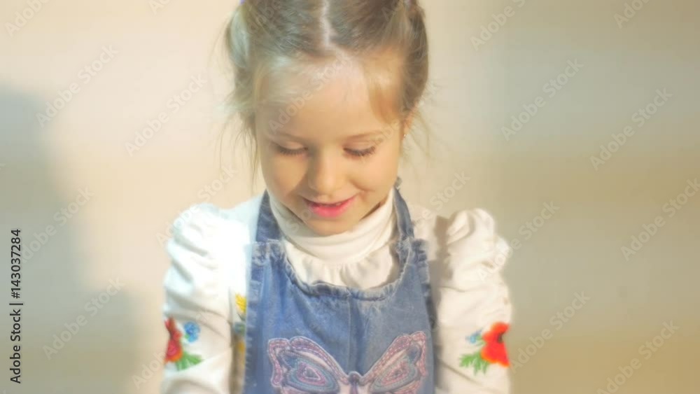 a Splendid Clay Craft is Made by a Little Girl, Dressed in Blue Apron and White Blouse, Who Tries to Produce Her Own Clay Pot a Splendid Clay Craft is Made by a Little Girl, Dressed in Blue Apron and White Blouse, Who Tries to Produce Her Own Clay Pot