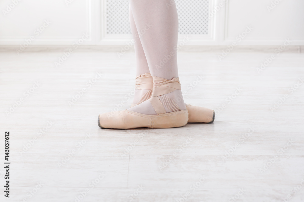 Ballerina legs closeup in third position Ballerina legs closeup in third position