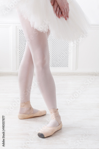 Ballerina legs closeup in fourth position