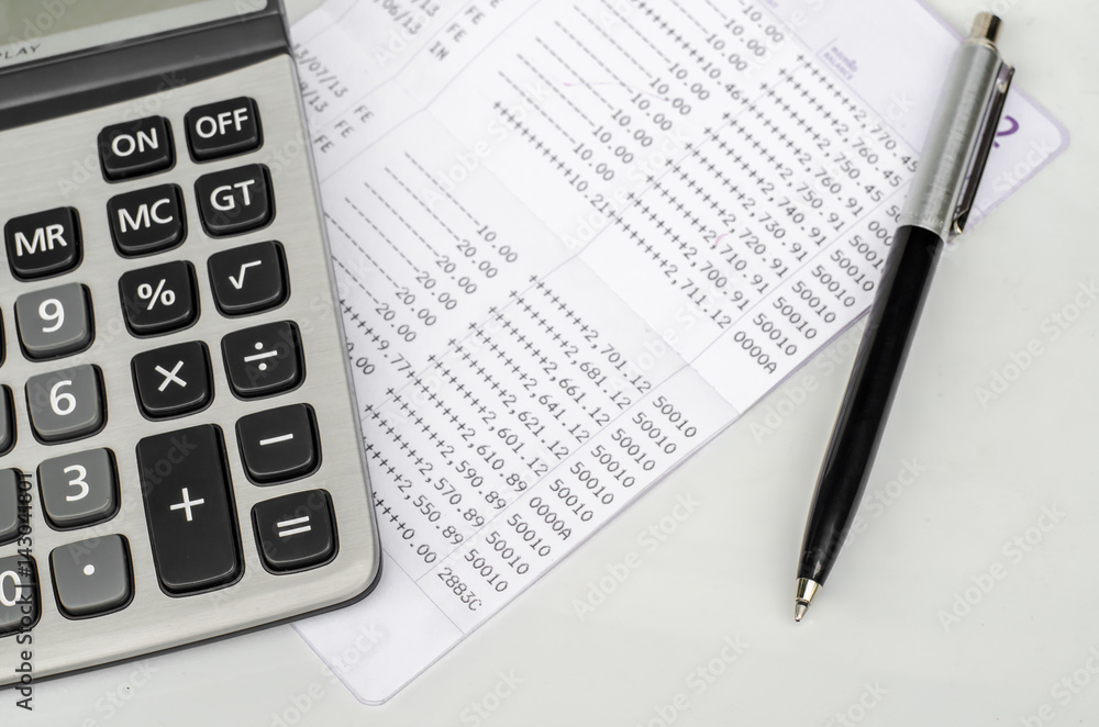 Bank account passbook with pen and calculator Bank account passbook with pen and calculator