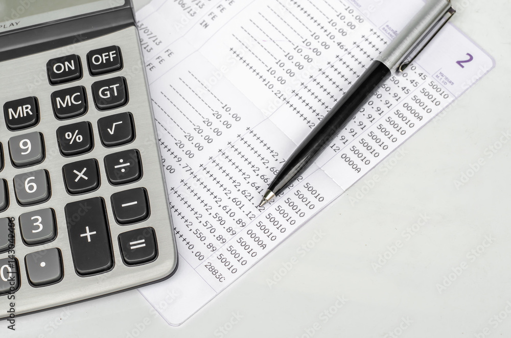 Bank account passbook with pen and calculator Bank account passbook with pen and calculator