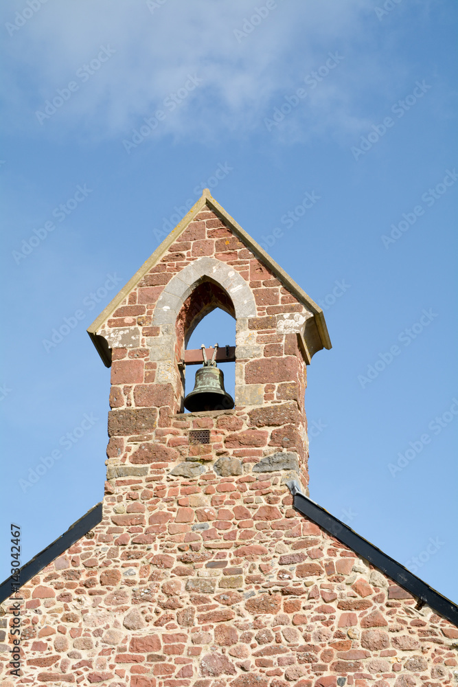 The bell tower at Saint Nicholas Church Ringmore in the Parish of Shaldon in Devon England
