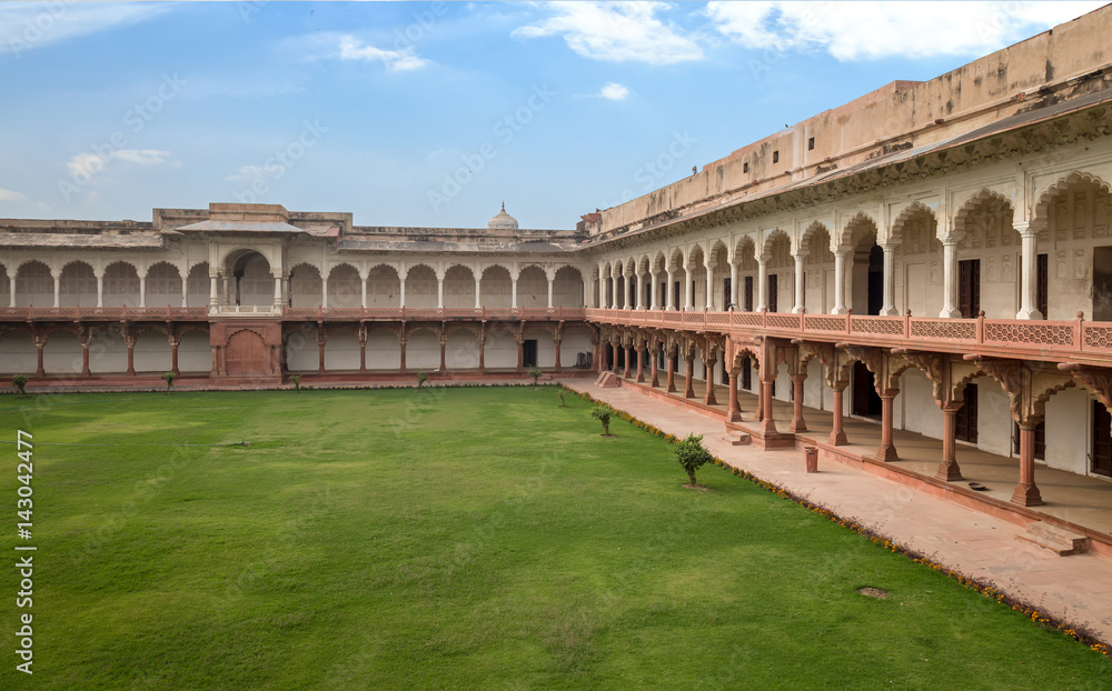 Agra fort built in Mughal India architecture design with long portico corridors.
