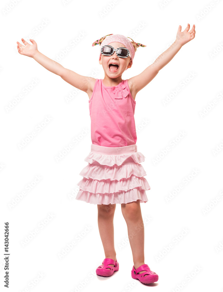 Cheerful little blonde in sunglasses with his hands raised up on white. Cheerful little blonde in sunglasses with his hands raised up on white.