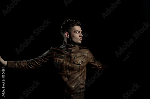 Handsome man posing in brown, leather jacket © Volodymyr