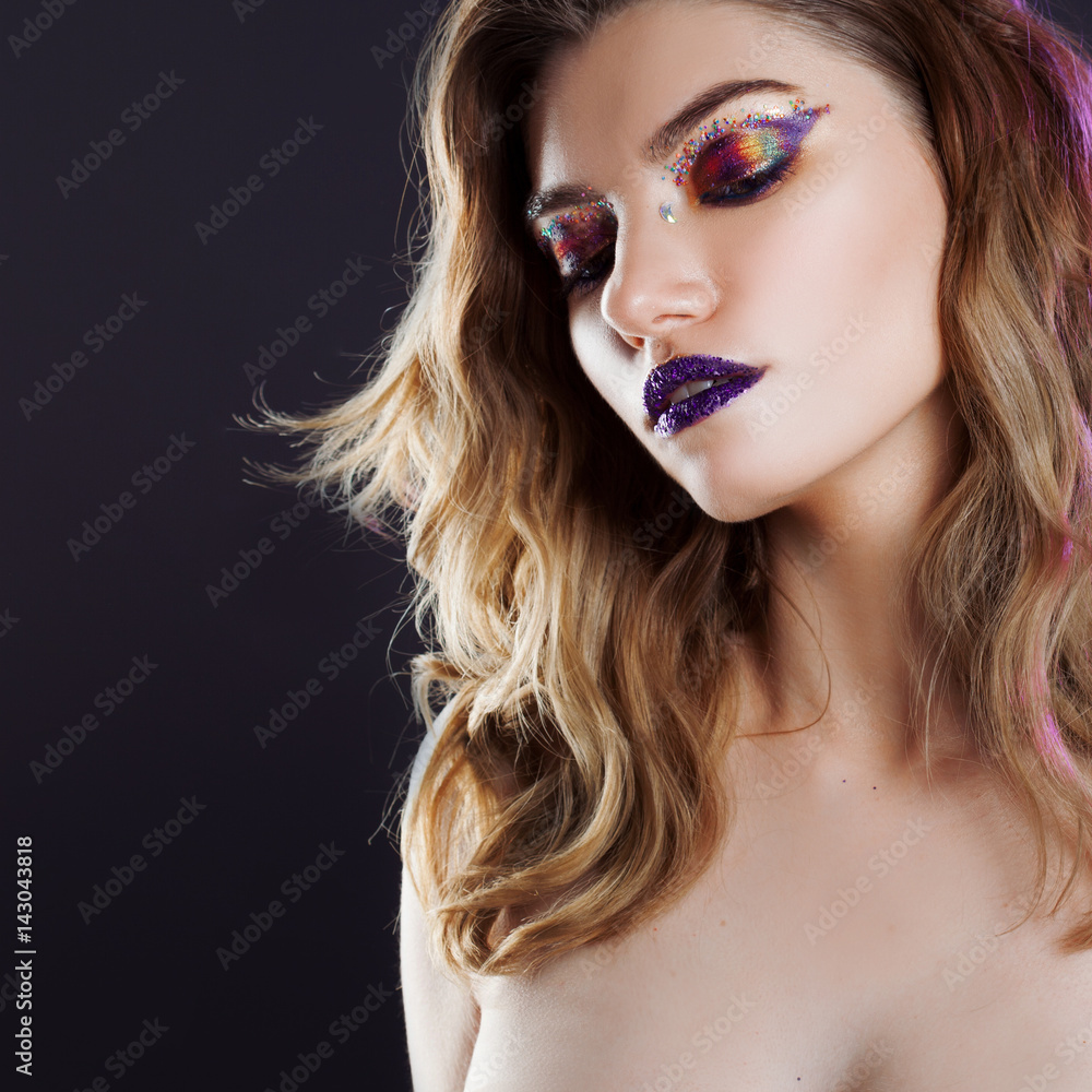 Fototapeta premium Young beautiful girl with creative make up. Attractive blonde, close-up