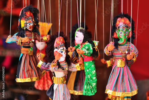 Traditional souvenir painted mashed paper (papier mache) dolls dressed in traditional costumes. Itchan Kala (Xiva Ichon Qala) UNESCO world heritage, Khiva, Uzbekistan. photo