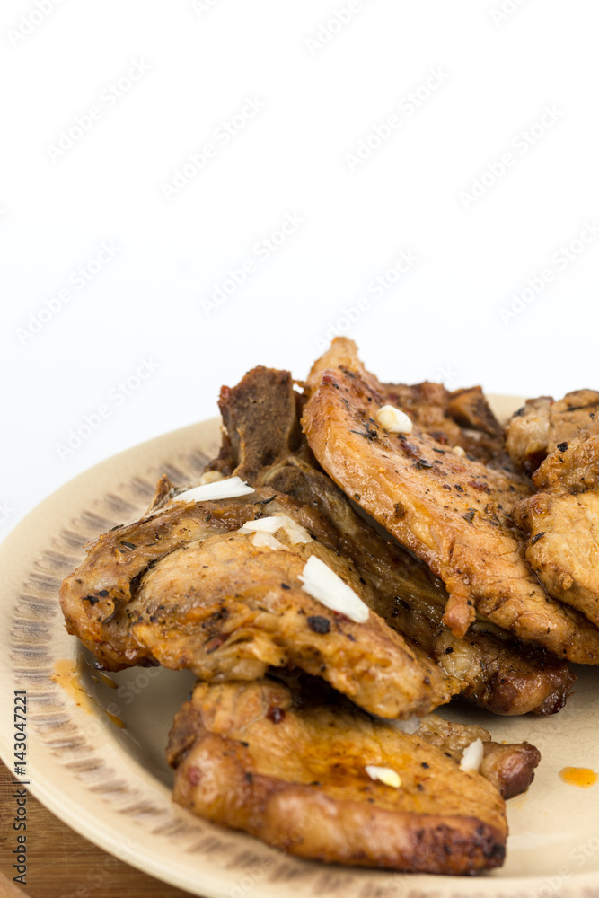 Fried pork chops served on the plate isolated over white background Fried pork chops served on the plate isolated over white background