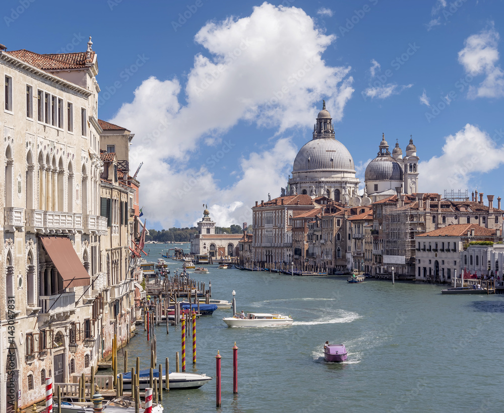 The Grand Canal and Basilica di Santa Maria della Salute from Ponte dell'Accademia against a beautiful sky, Venice, Italy