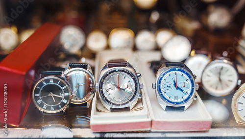Men wrist watches in a showcase of a luxury store