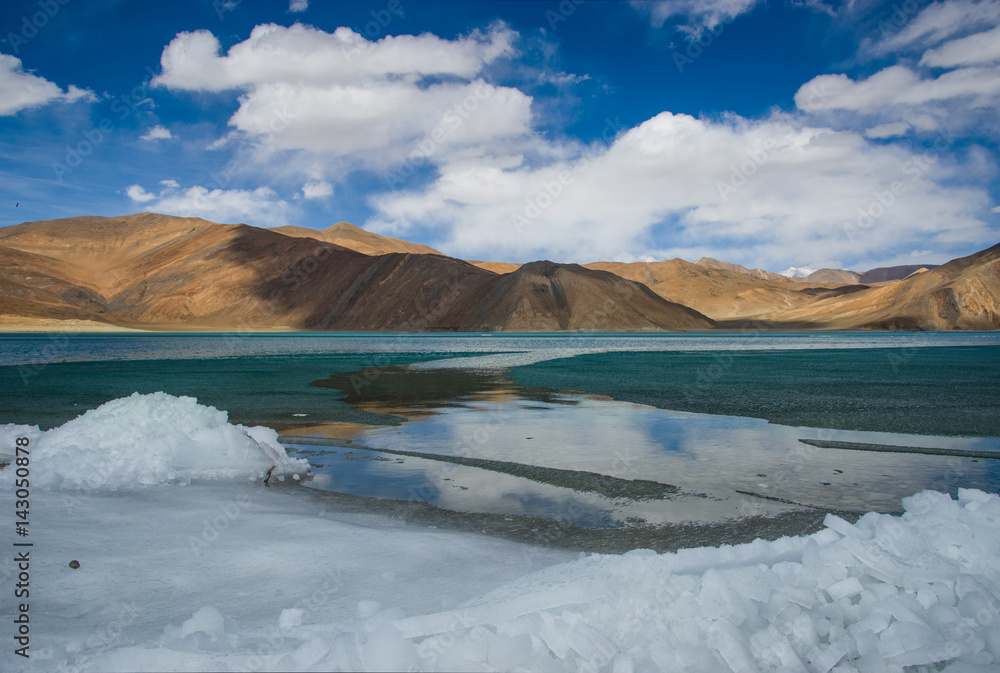 Beautiful landscape of Pangong lake over blue sky in Leh Ladakh, India.