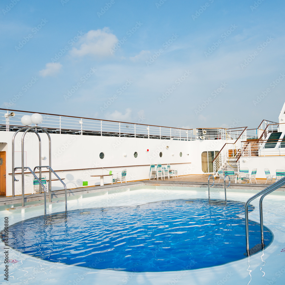 View of top deck of cruise ship with pool.