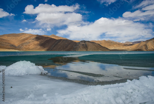 Beautiful landscape of Pangong lake over blue sky in Leh Ladakh, India.