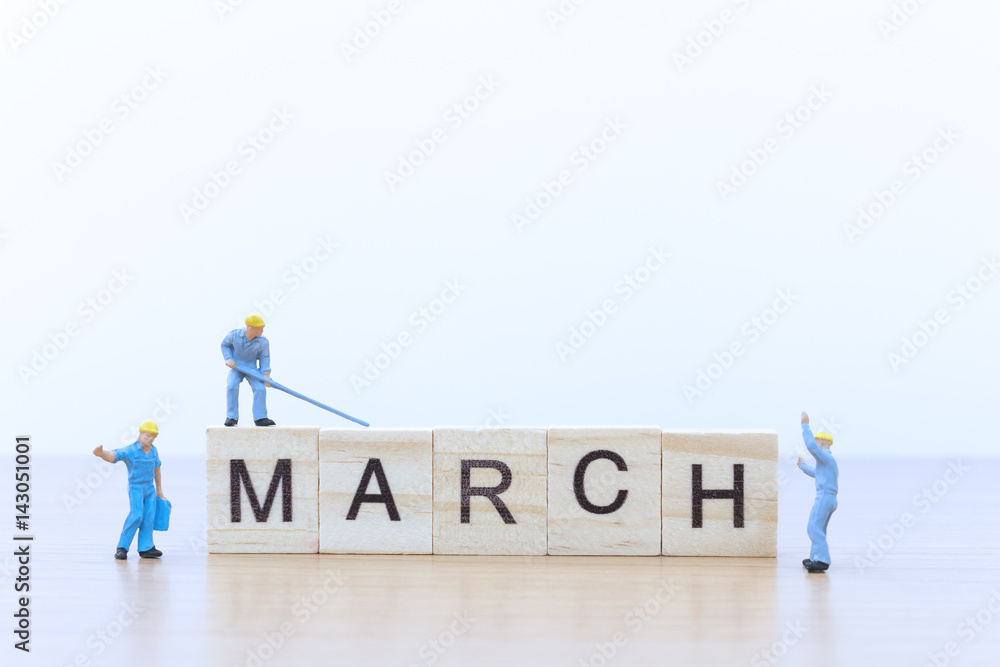 March words with Miniature people worker March words with Miniature people worker