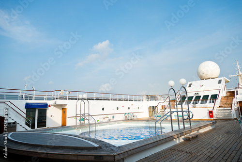 View of top deck of cruise ship with pool.