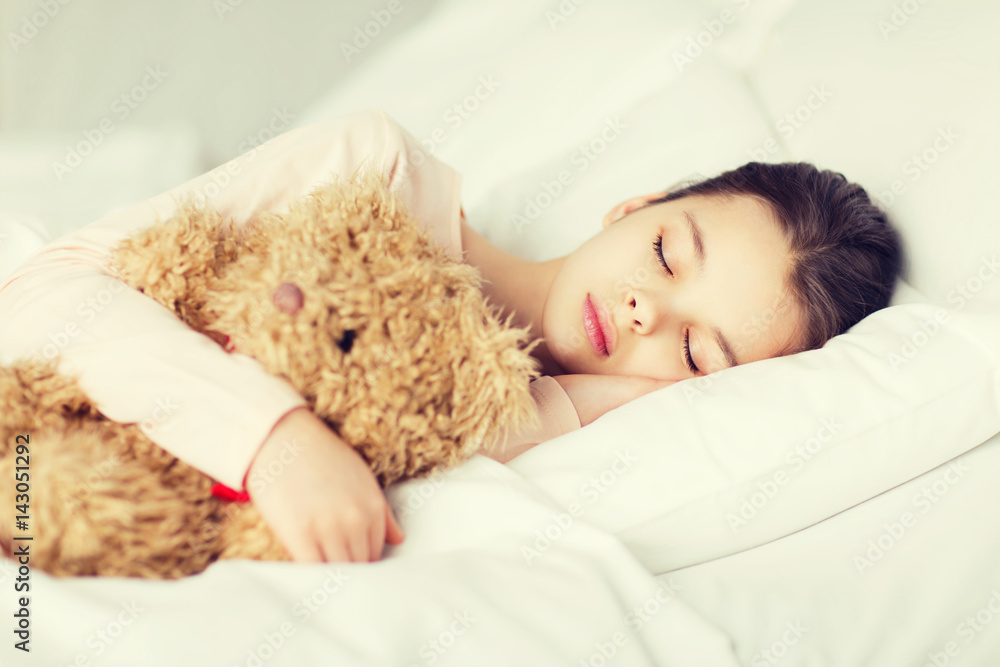 girl sleeping with teddy bear toy in bed at home girl sleeping with teddy bear toy in bed at home