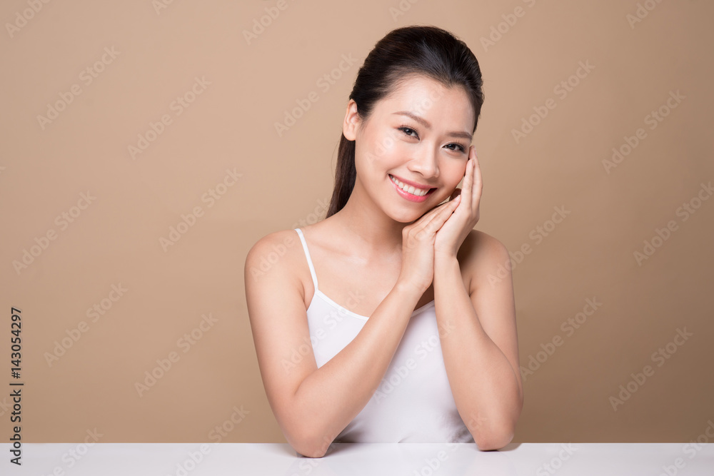 Beauty face. Facial treatment. Young asian woman with clean perfect skin touch her face. Beauty face. Facial treatment. Young asian woman with clean perfect skin touch her face.