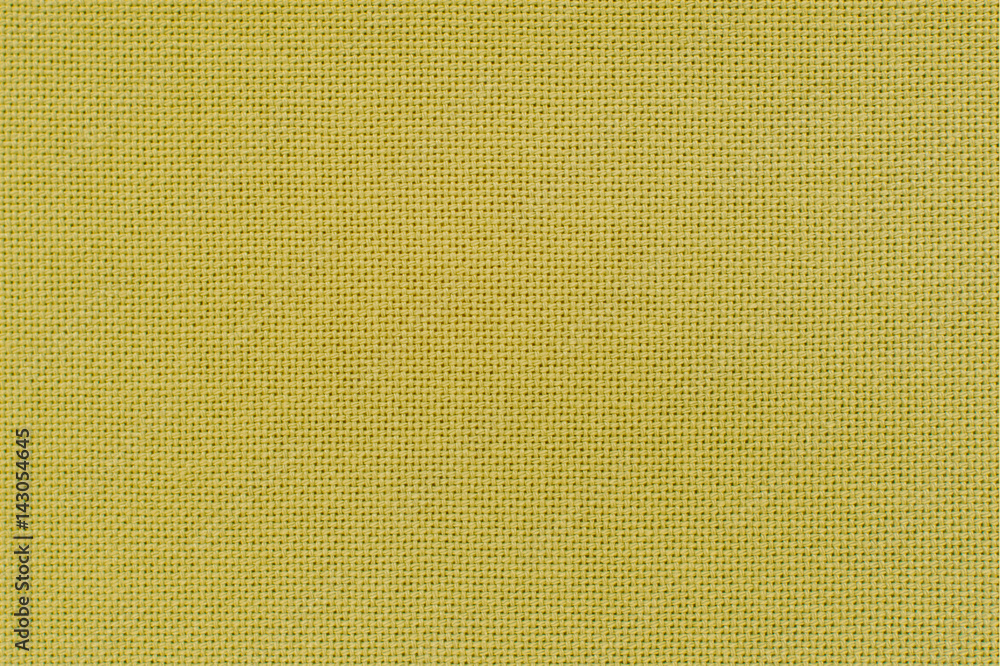 Fototapeta premium Texture of the yellow color linen fabric. Close-up view for the background.