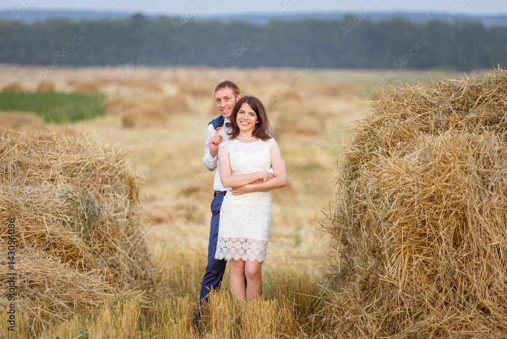 couple walking on field. couple walking on field.