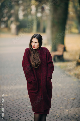  young woman in  coat posing © VAKSMANV
